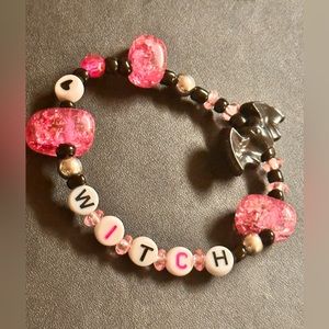 witch bracelet. friendship bracelet. handmade. pink and black. witchy. stretchy